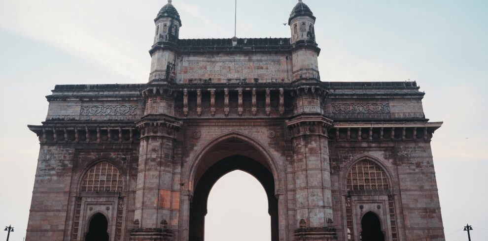Captivating view of the historical Gateway of India monument under a clear blue sky in Mumbai.