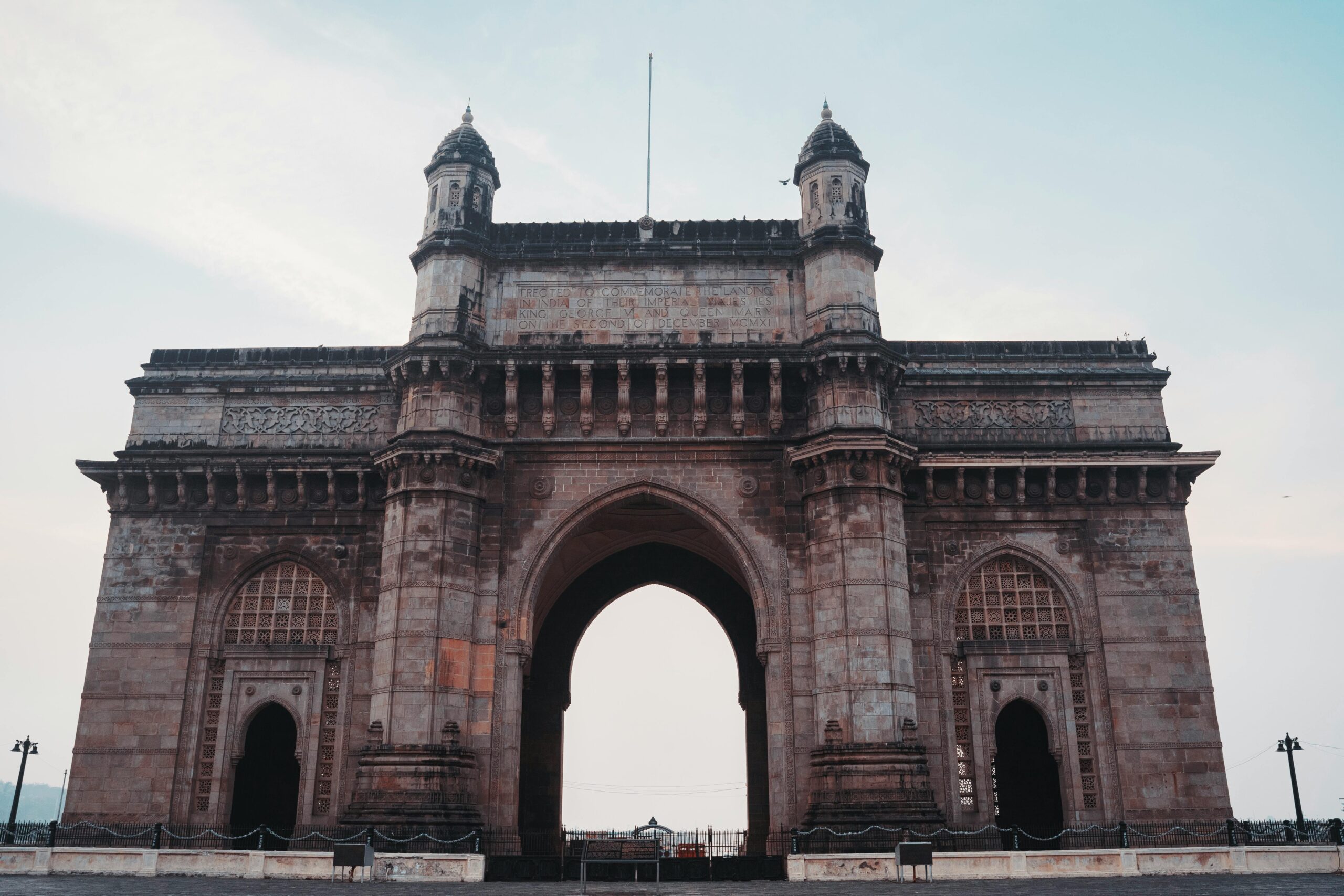 Captivating view of the historical Gateway of India monument under a clear blue sky in Mumbai.