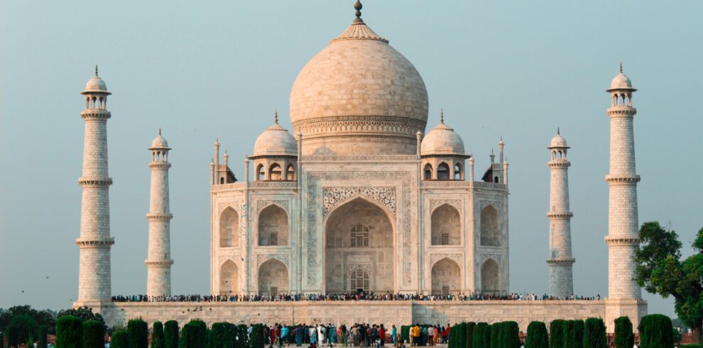 A stunning shot of the Taj Mahal in Agra, showcasing its iconic architecture and serene surroundings.