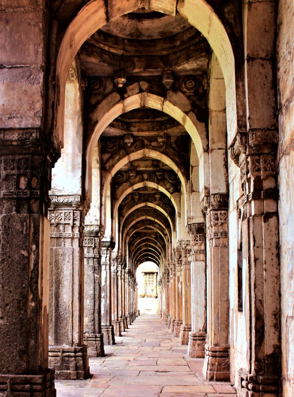 A stunning view of ancient stone arches in a historic Indian architectural landmark.