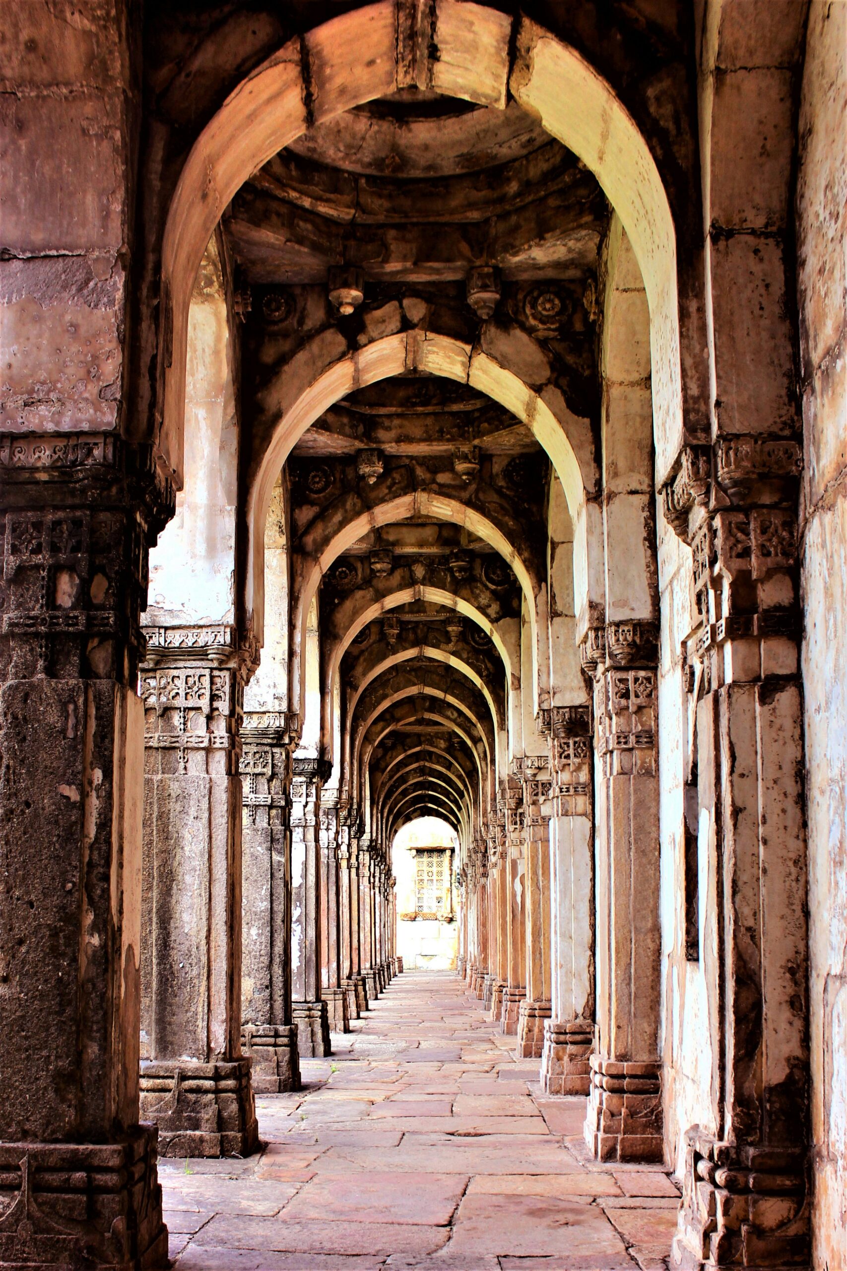 A stunning view of ancient stone arches in a historic Indian architectural landmark.
