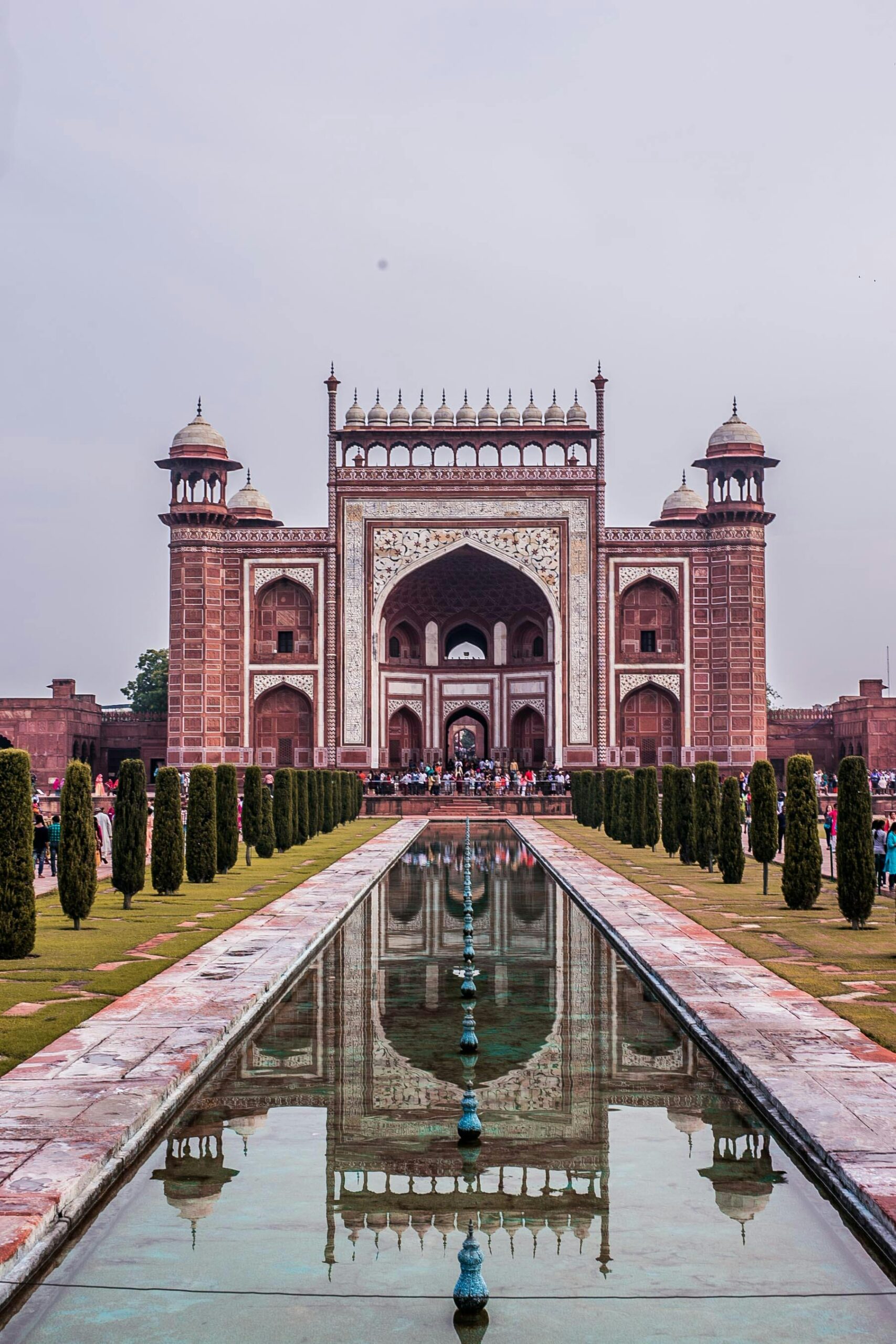 Stunning view of an Indian monument's entrance with symmetrical reflection.
